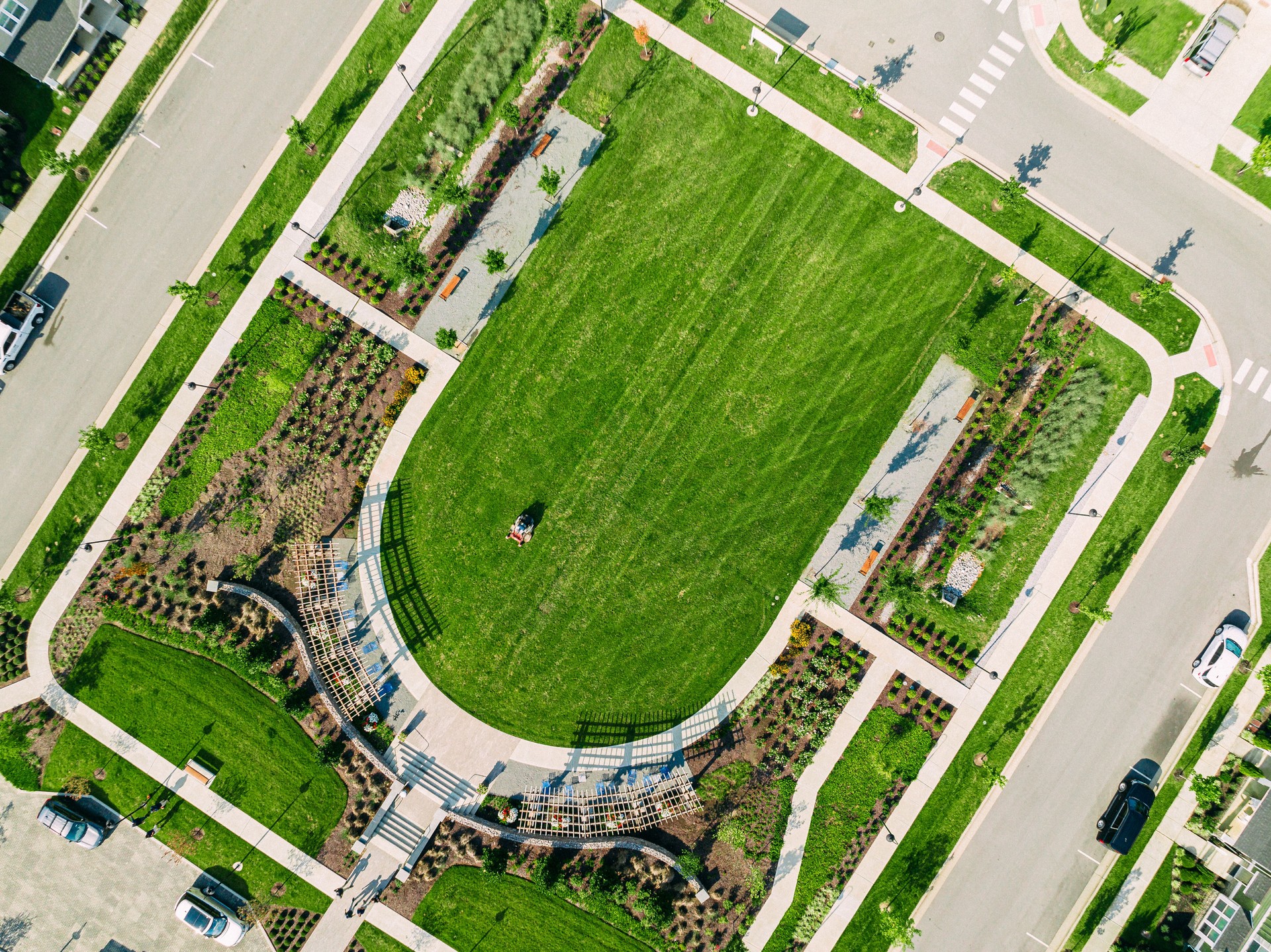 Elevated View of a Riding Lawnmower to Cut Grass in a Diagonal Pattern